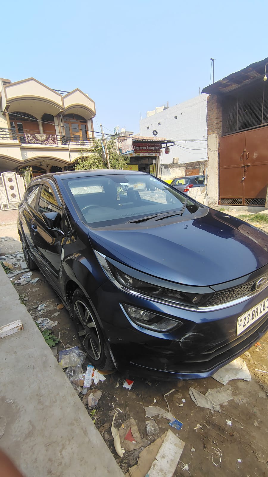 Front three-quarter view of a royal blue Tata Altroz