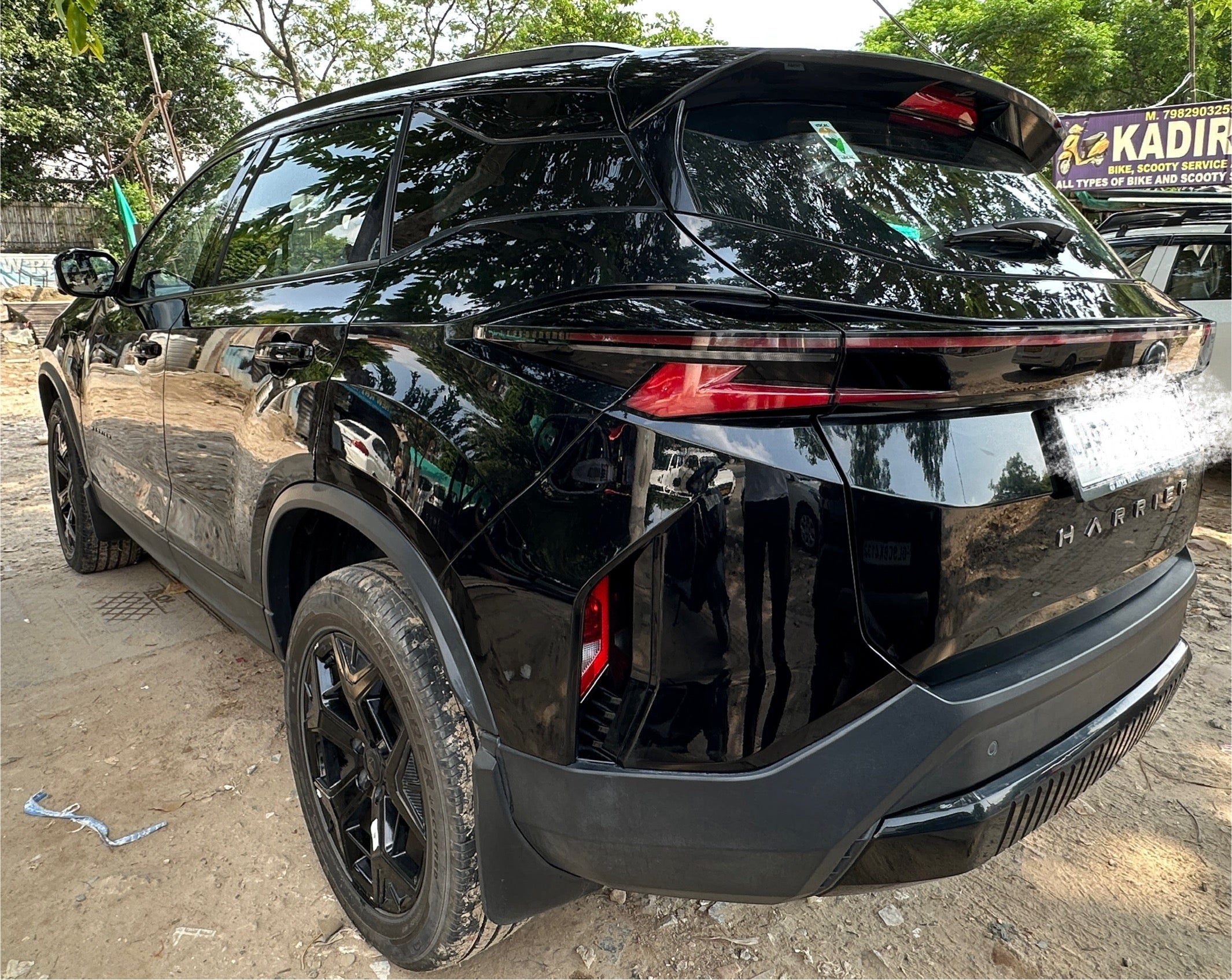 Rear three-quarter view of a Oberon Black Tata Harrier