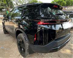 Rear three-quarter view of a Oberon Black Tata Harrier