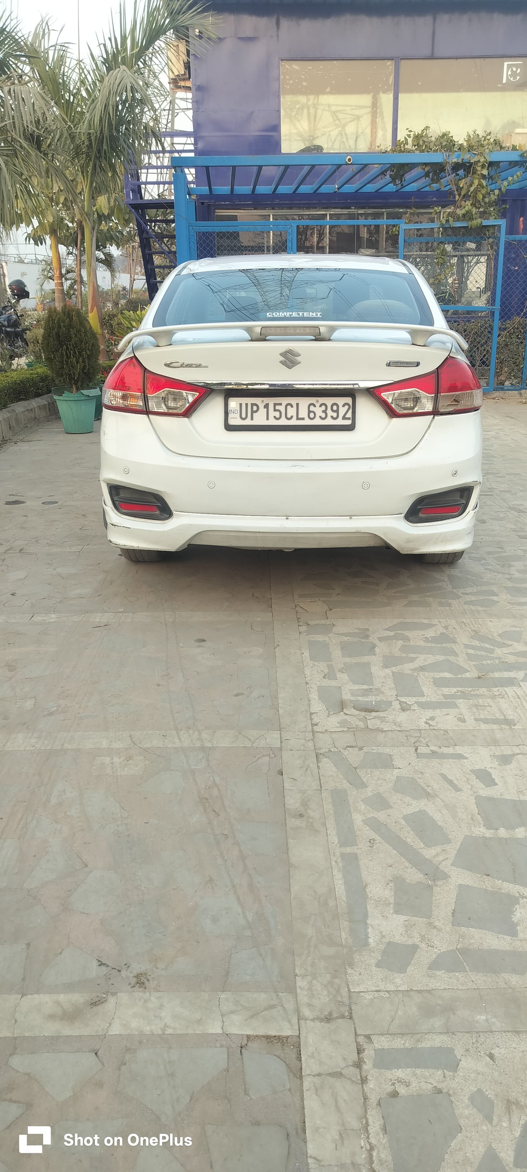 Rear view of a pearl-arctic-white Maruti Suzuki Ciaz