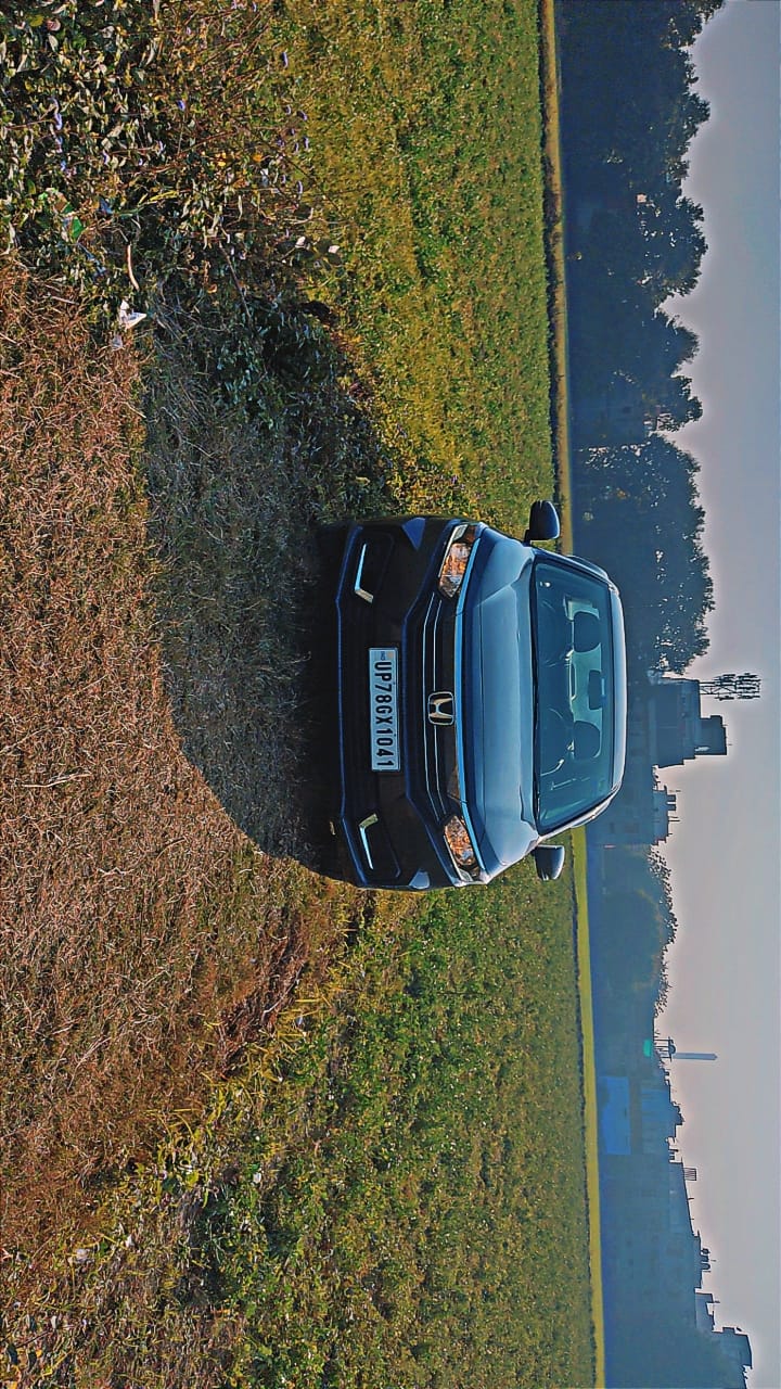 Front view of a meteoroid grey metallic Honda Amaze