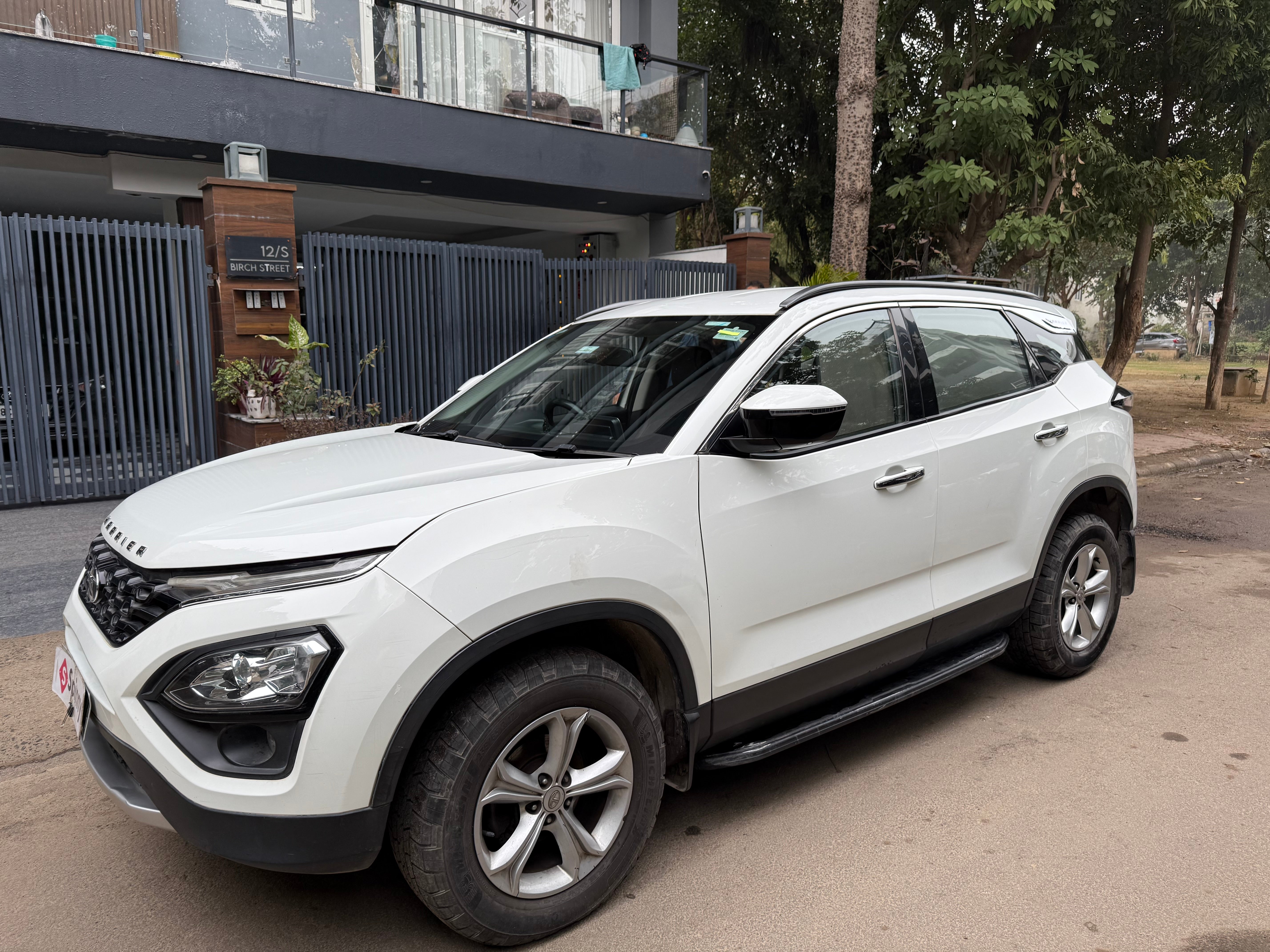 Front side view of a Lunar White Tata Harrier