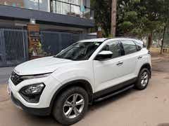 Front side view of a Lunar White Tata Harrier