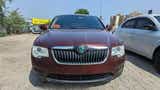 Front view of a steel grey Skoda Superb
