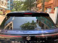 Rear view of a Nexa Blue Maruti Suzuki Grand Vitara