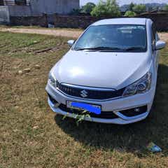 Front view of a pearl arctic white Maruti Suzuki Ciaz