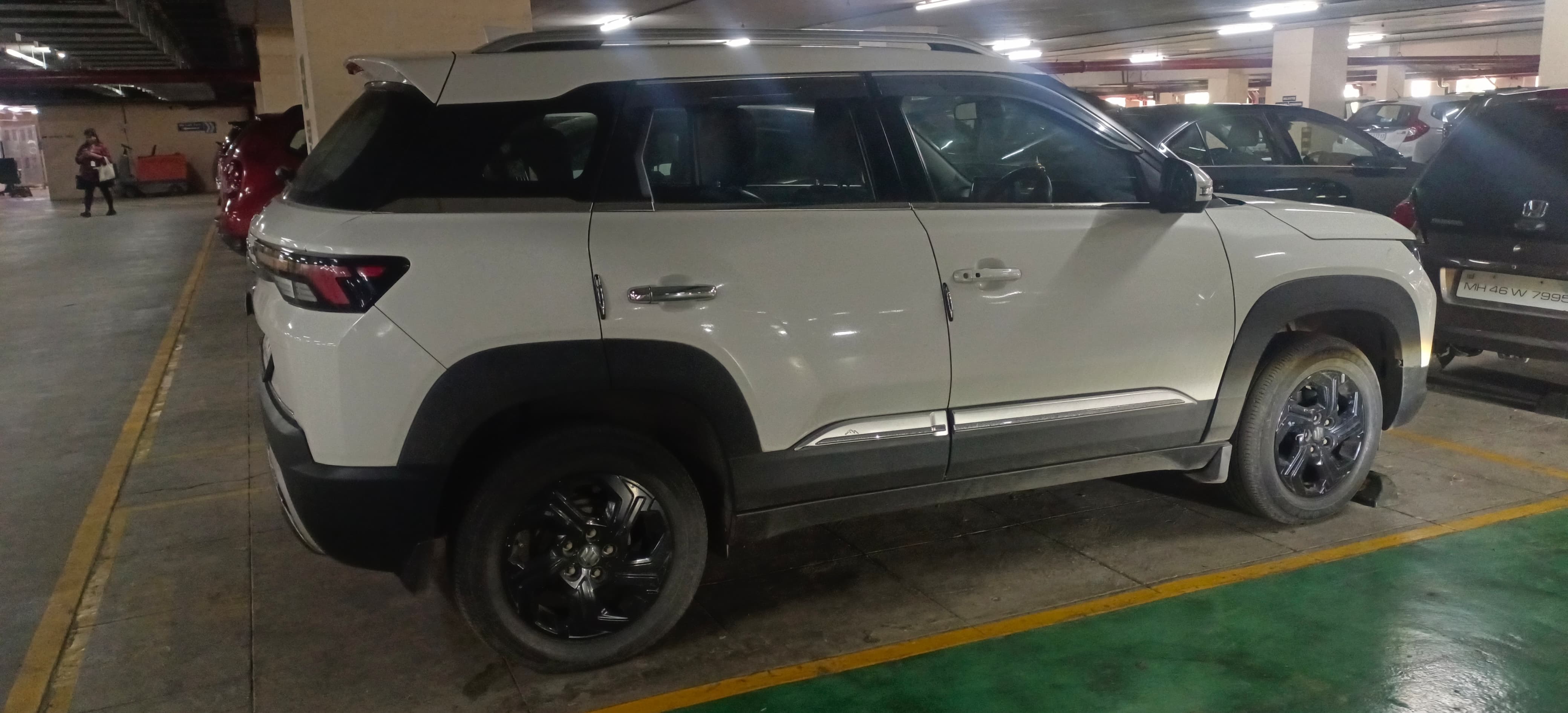 Side view of a pearl arctic white Maruti Suzuki Brezza