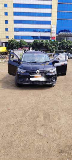 Front view of a stealth-black Renault Triber