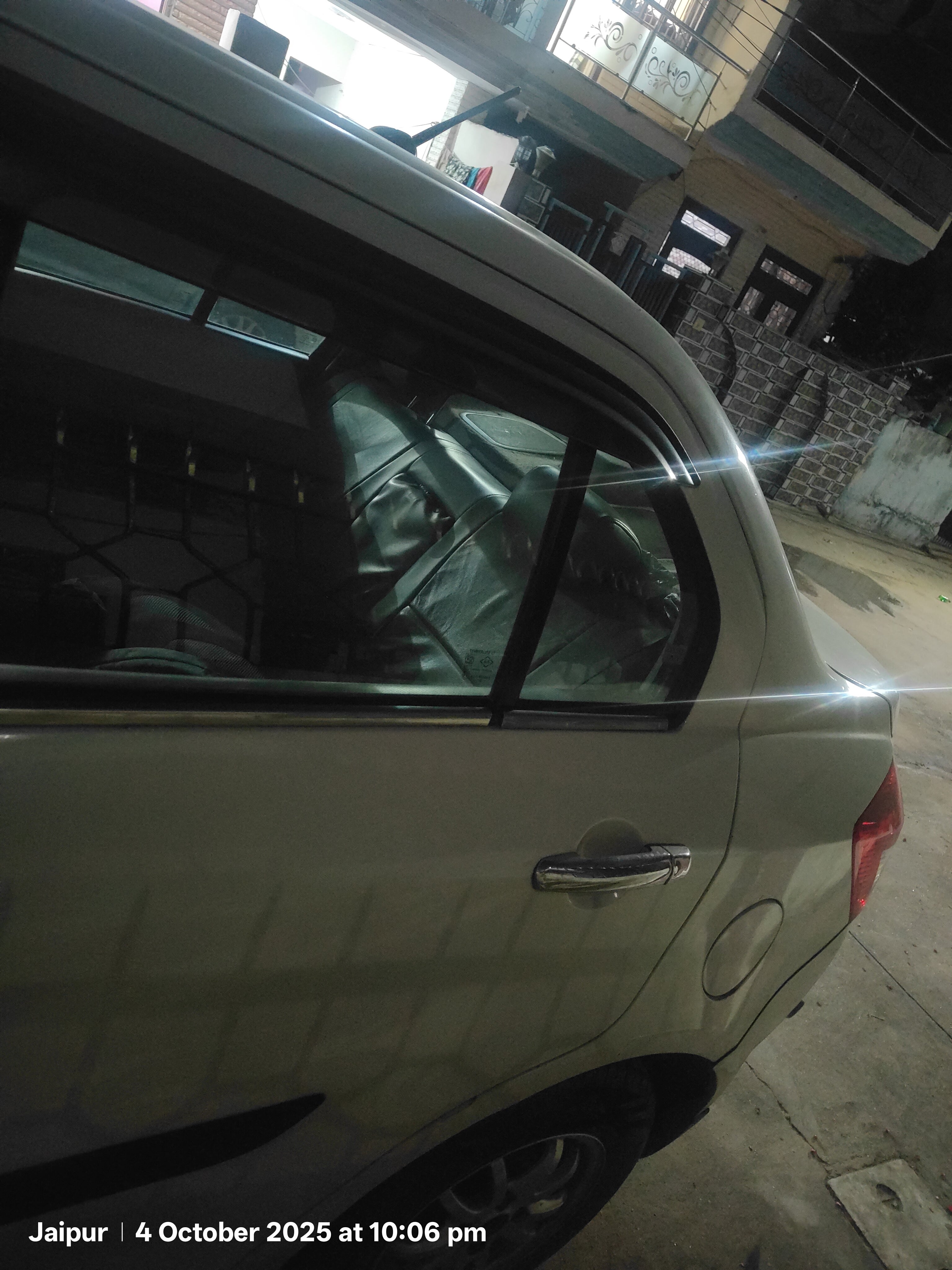 Rear-side view of a splendid silver Maruti Suzuki Dzire 2018-2023 in Jaipur