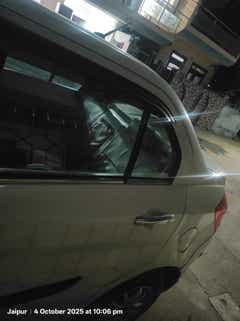 Rear-side view of a splendid silver Maruti Suzuki Dzire 2018-2023 in Jaipur