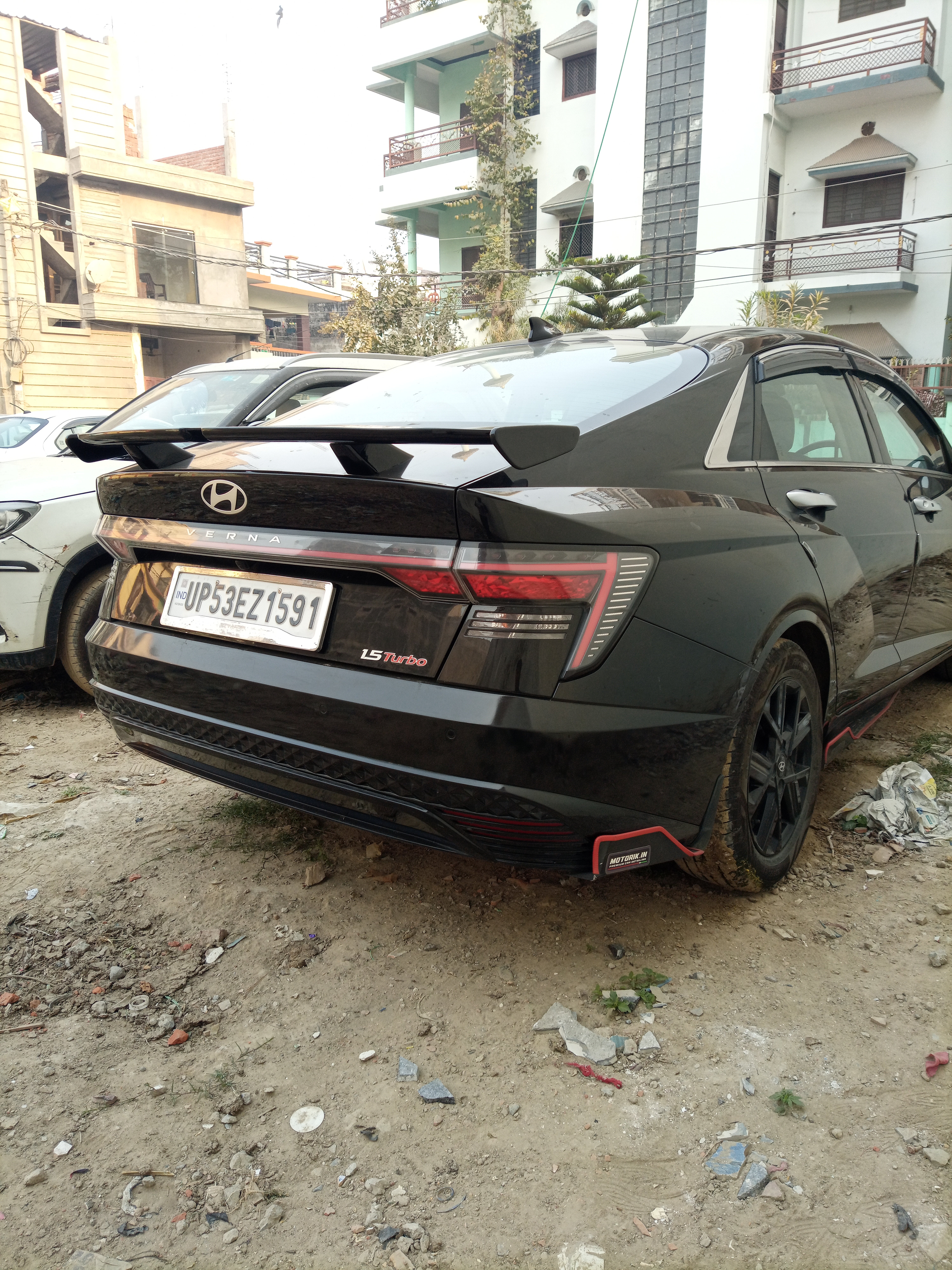 Rear three-quarter of a abyss black Hyundai Verna 1.5 turbo