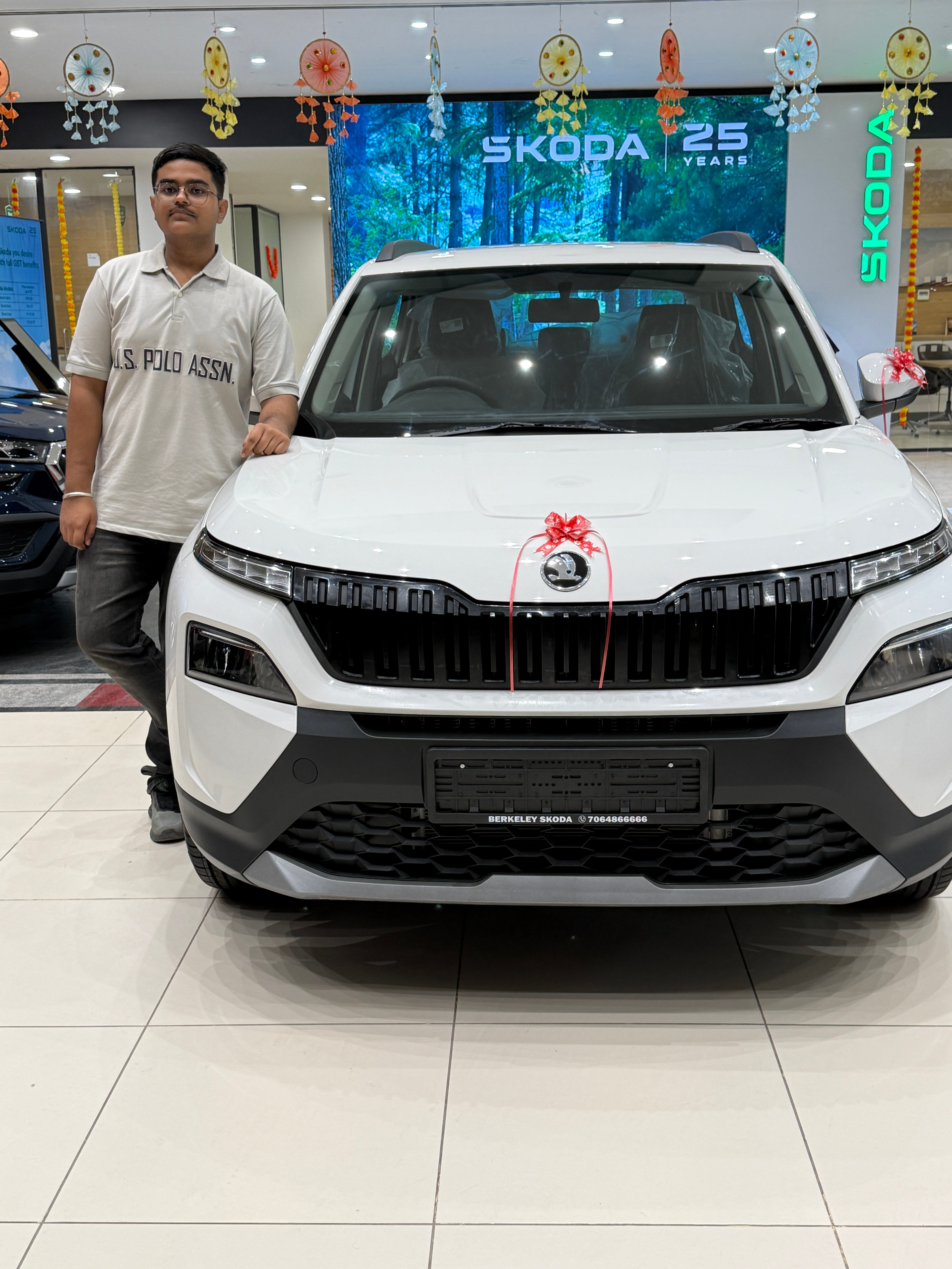 Front view of a Candy White Skoda Kylaq