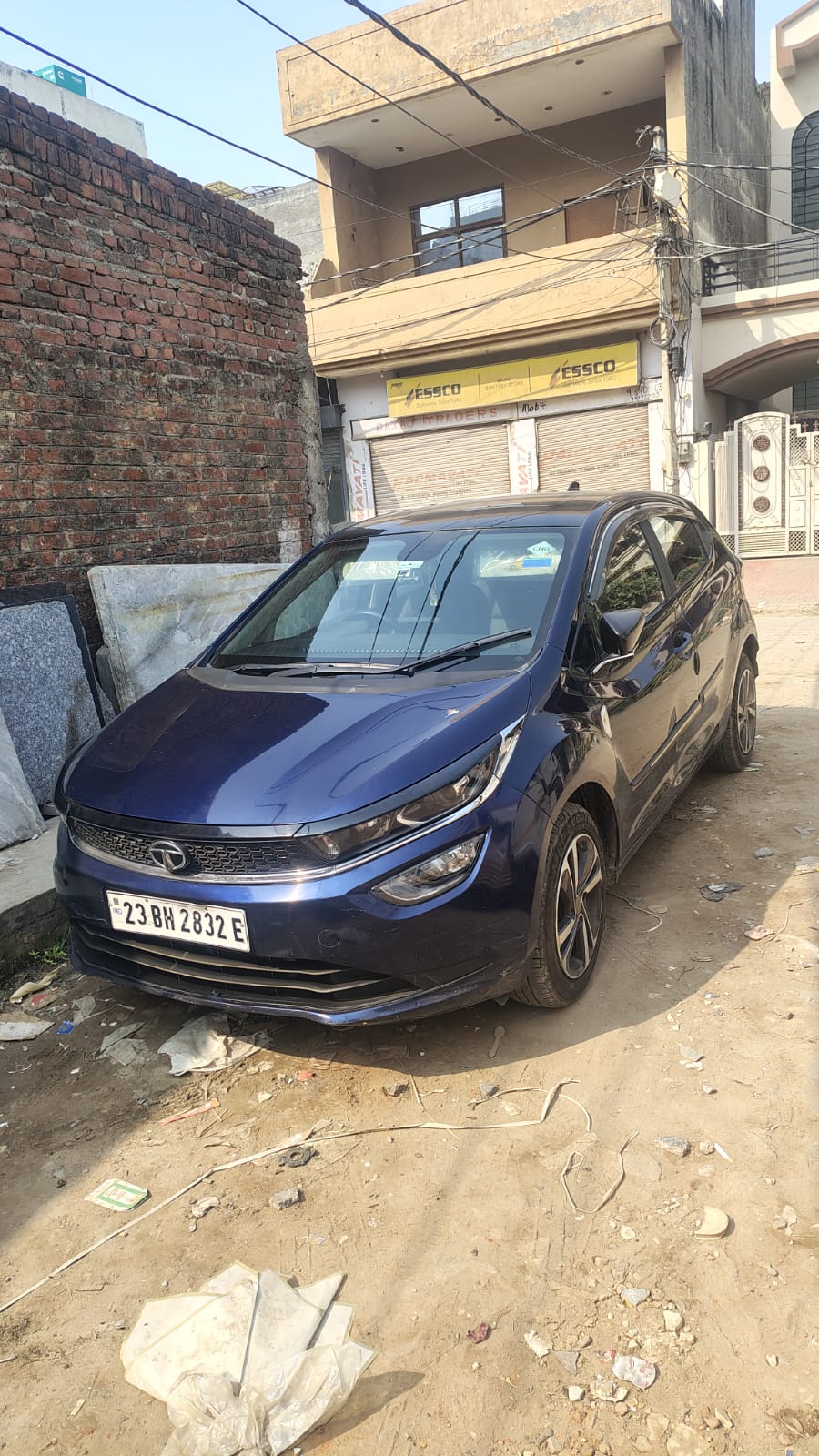 Front three-quarter view of a royal blue Tata Altroz