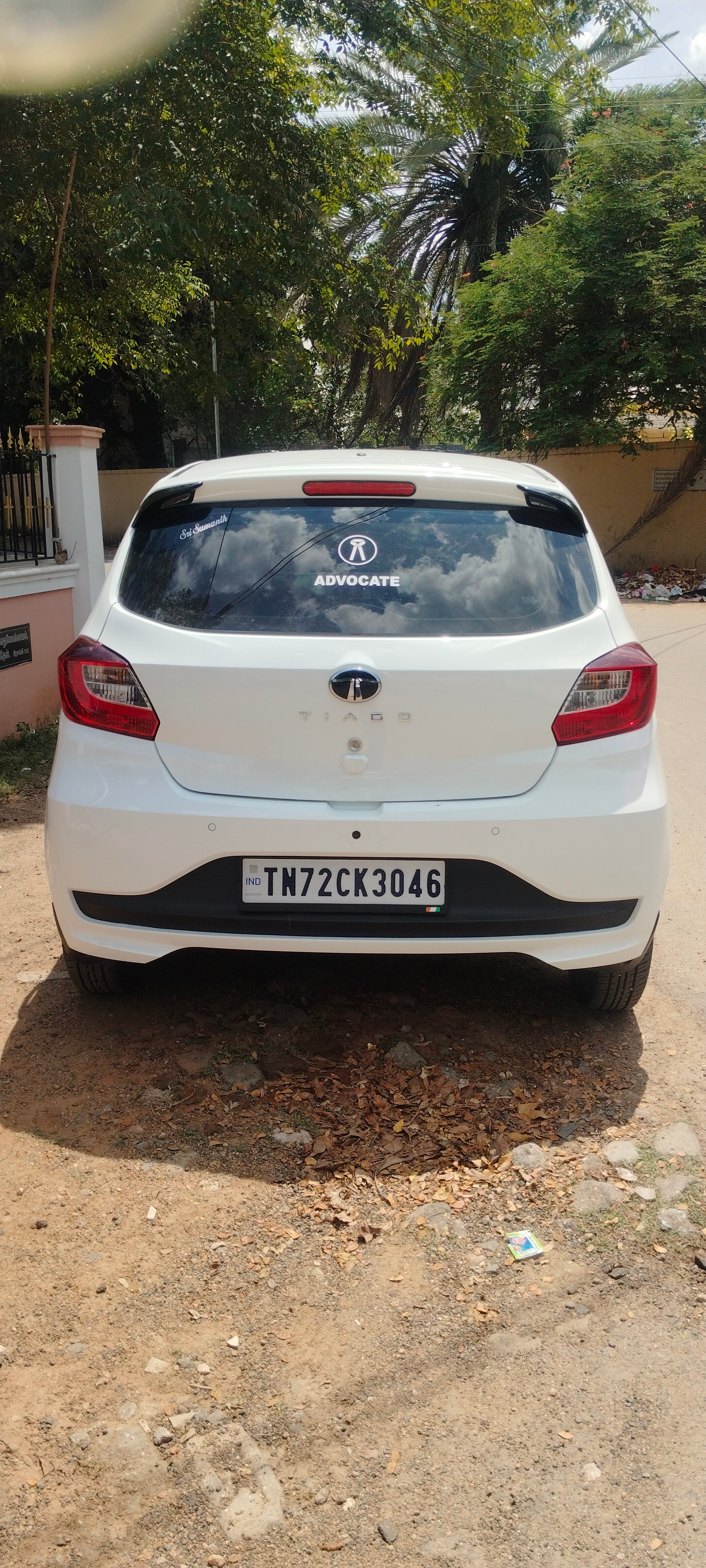 Rear view of a Pristine White Tata Tiago