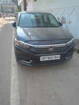 Front view of a meteoroid grey metallic Honda Amaze