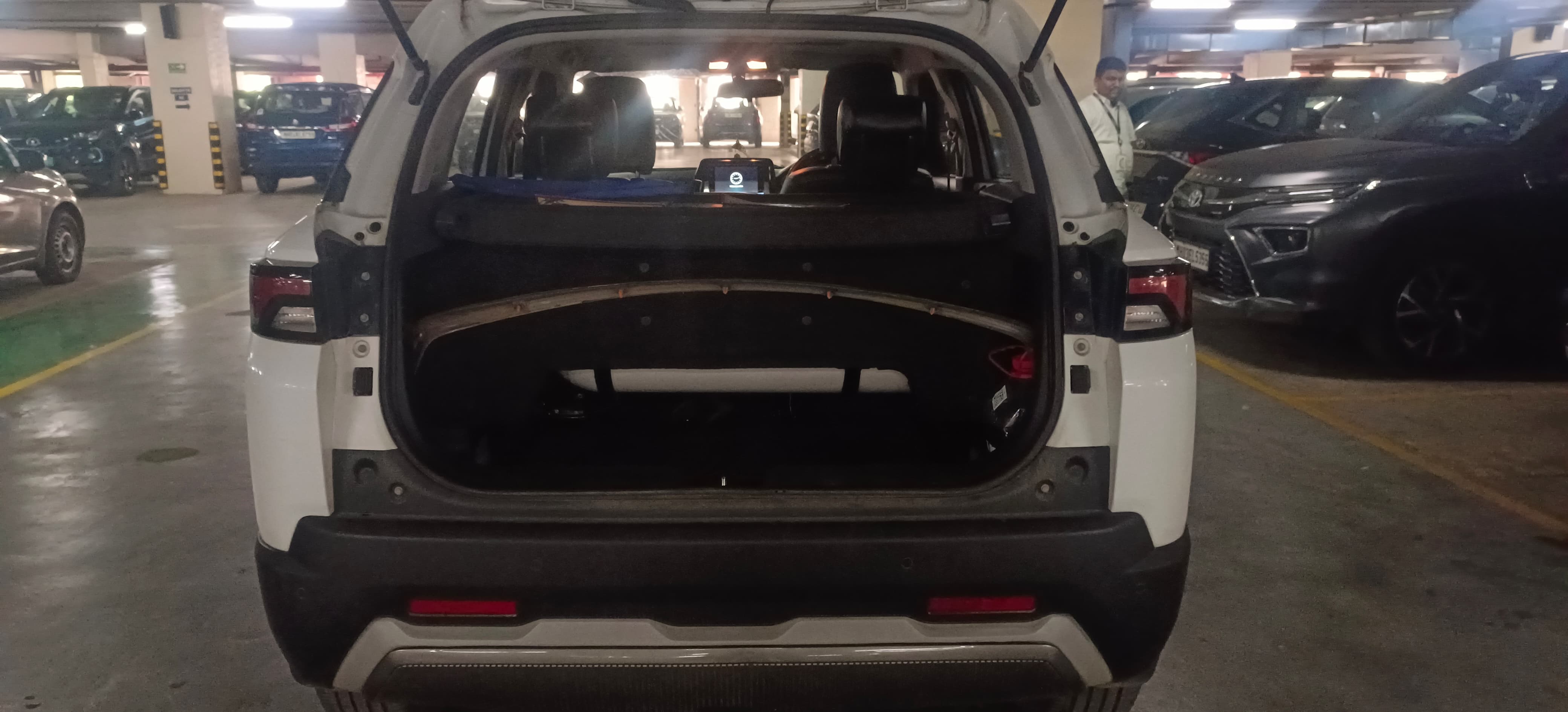 Rear view of a Pearl Arctic White Maruti Suzuki Brezza