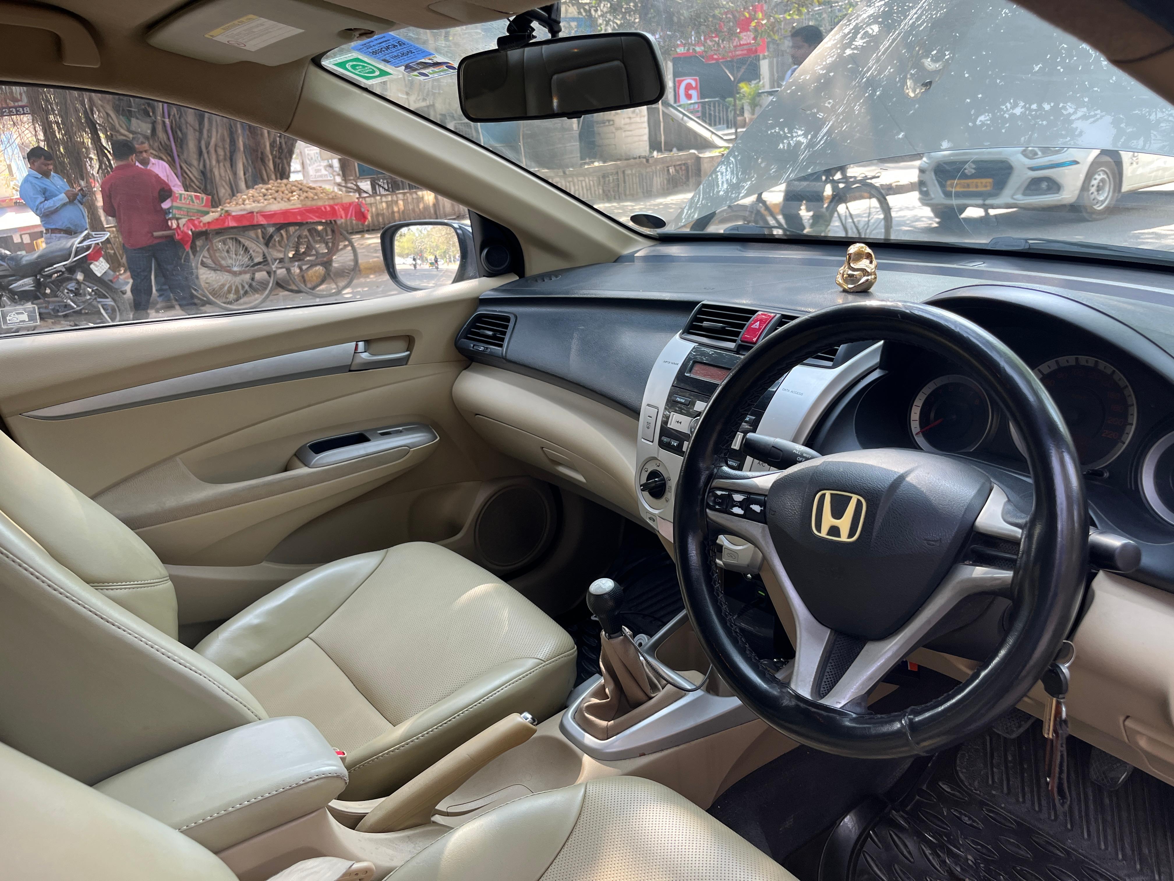 Interior dashboard and steering wheel of a Honda City