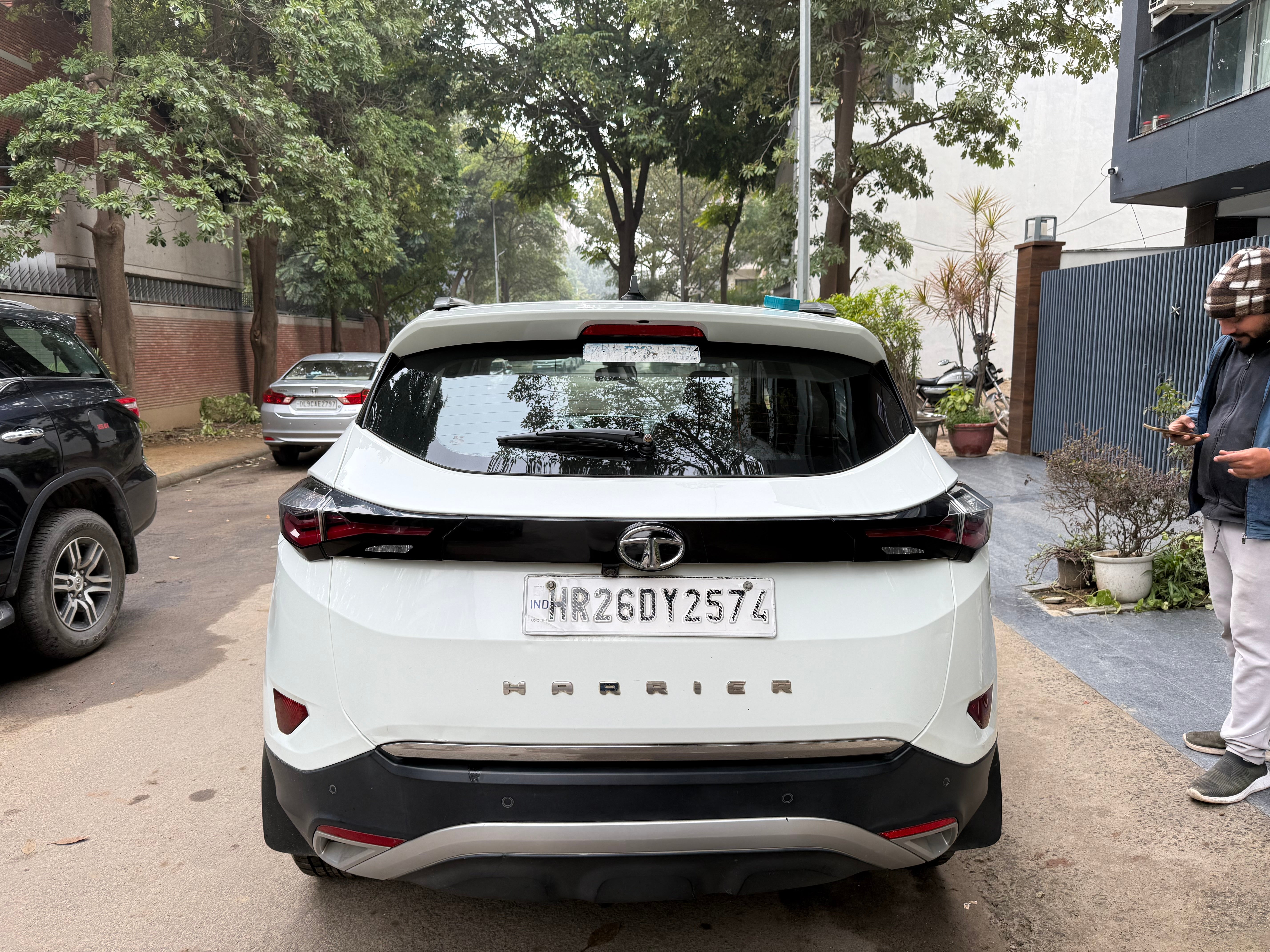 Rear view of a lunar white Tata Harrier