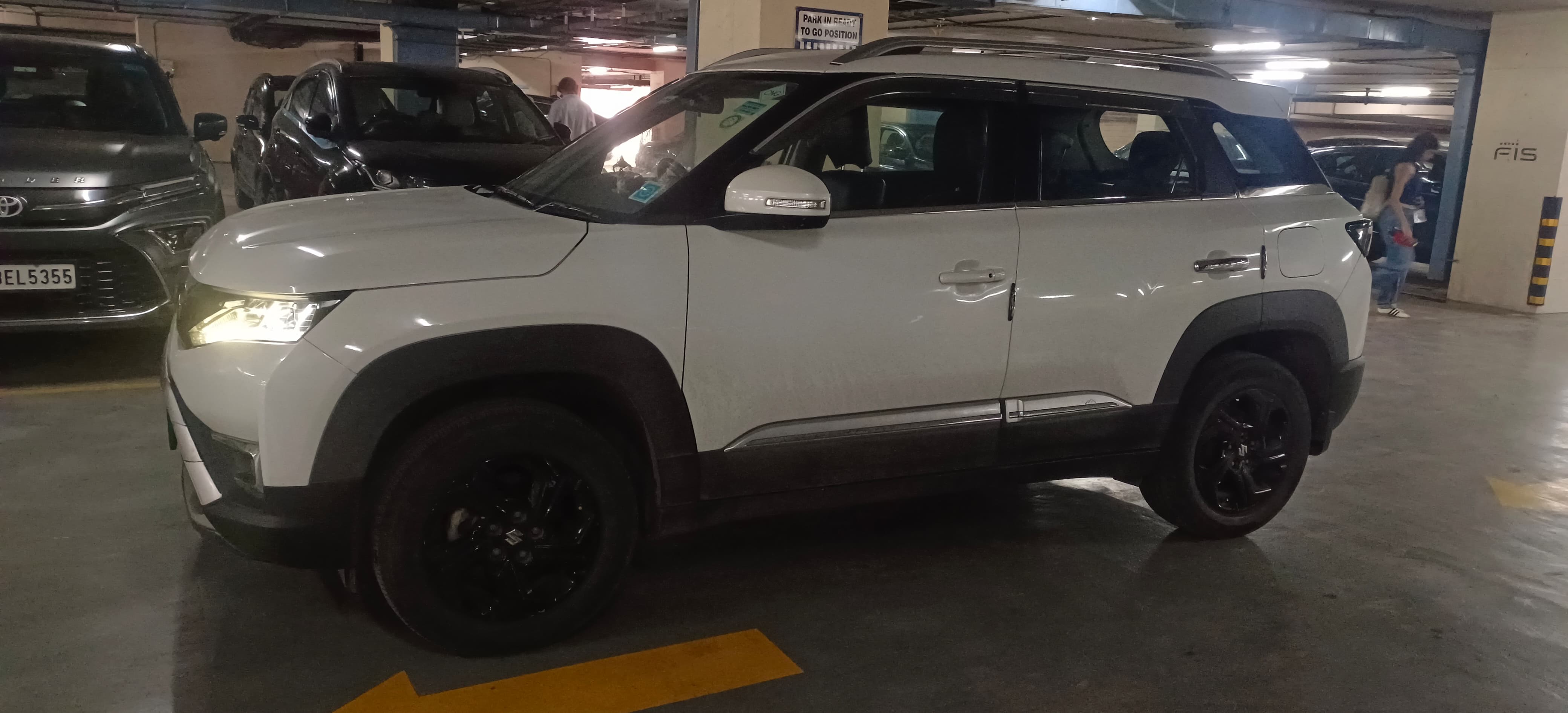 Side view of a Pearl Arctic White Maruti Suzuki Brezza