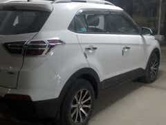 Rear three-quarter view of a Atlas White Hyundai Creta