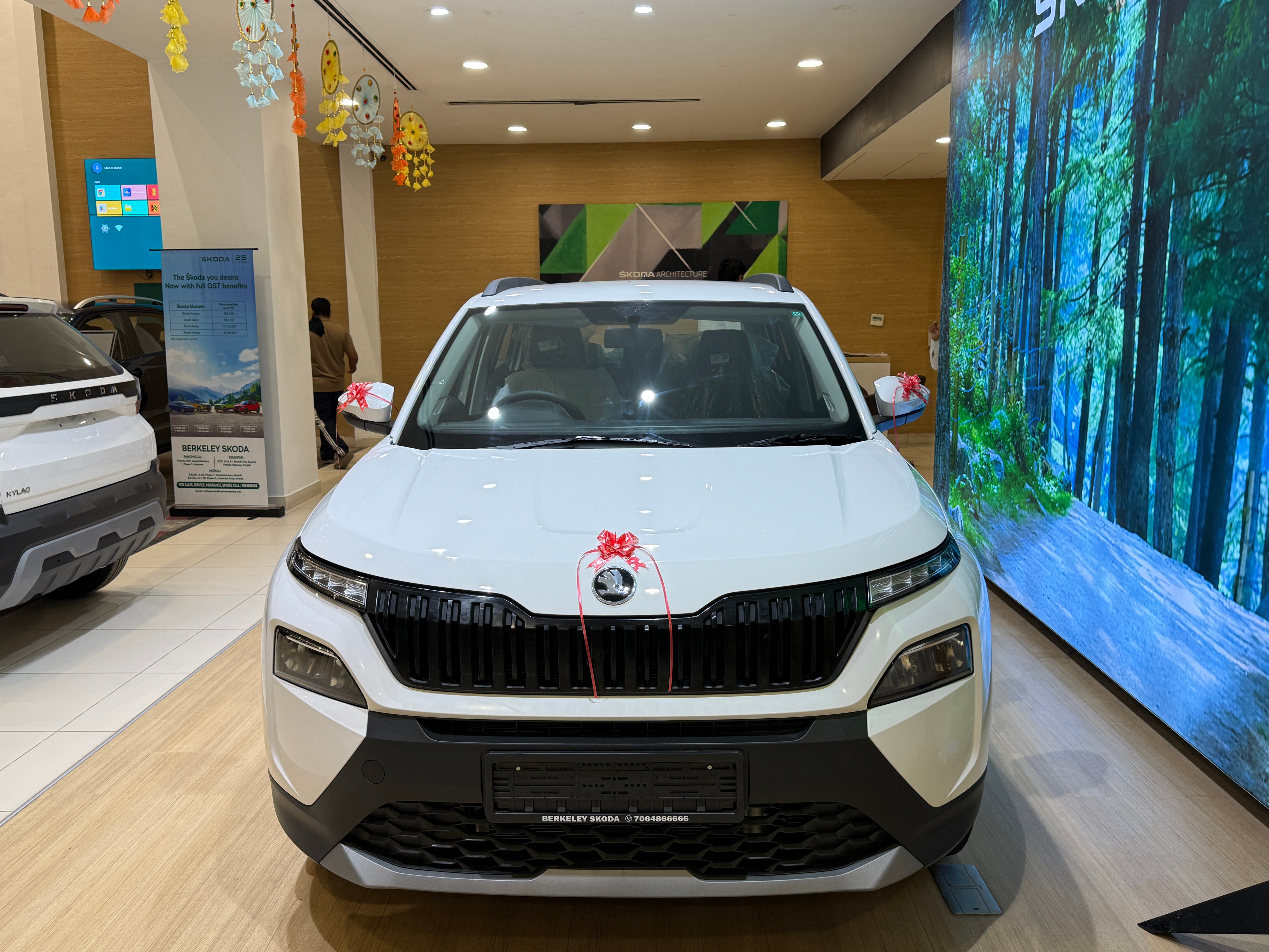 Front view of a Candy White Skoda Kylaq