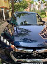 Front view of a nexa blue Maruti Suzuki Grand Vitara
