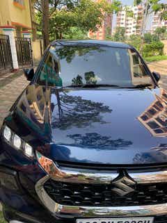 Front view of a nexa blue Maruti Suzuki Grand Vitara