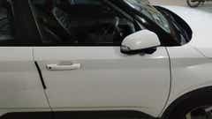 Front side door and mirror of a Atlas White Hyundai Venue