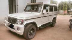 Front three-quarter of a Diamond White Mahindra Bolero