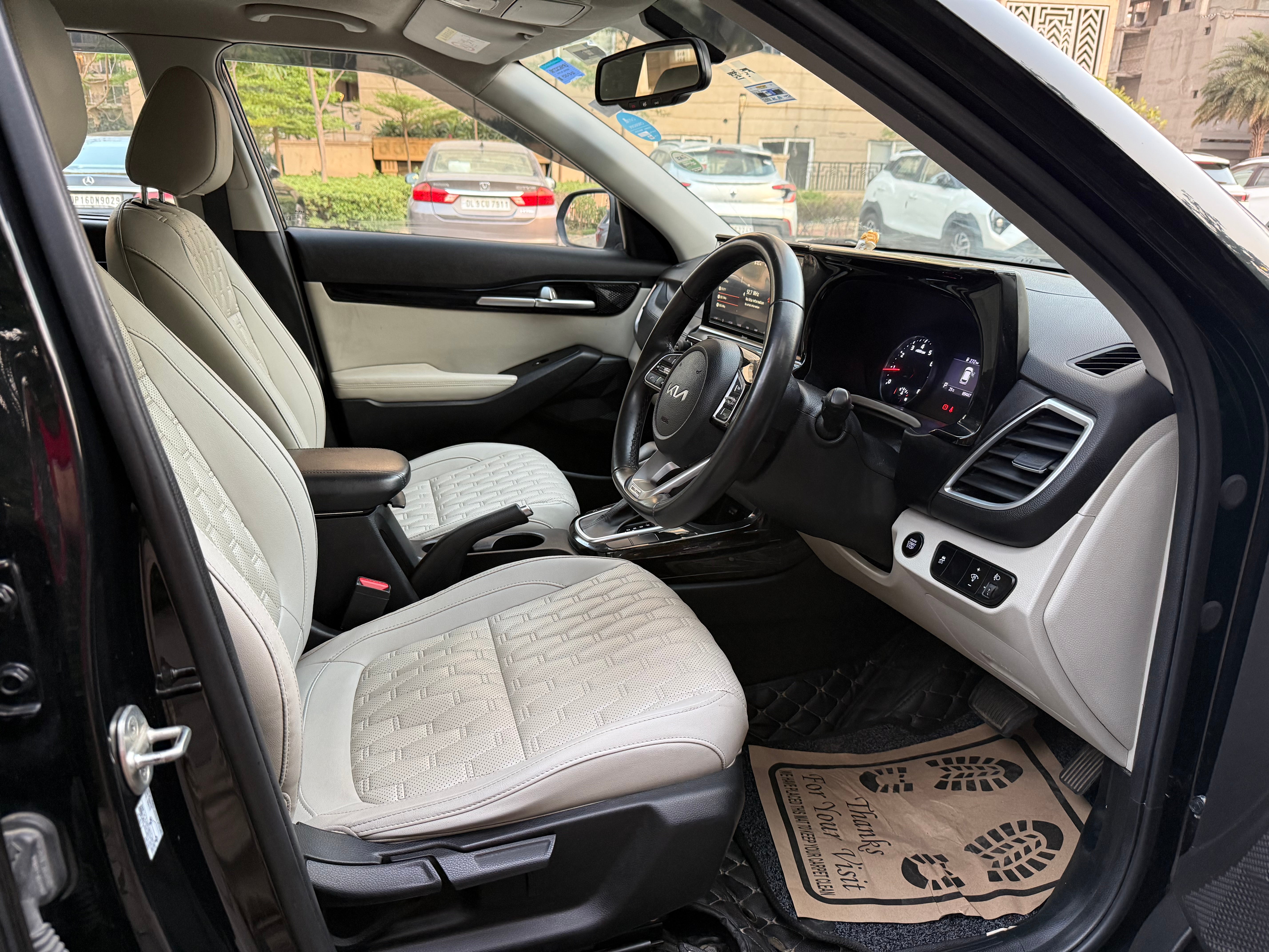 Interior front seats and dashboard of a Kia Seltos