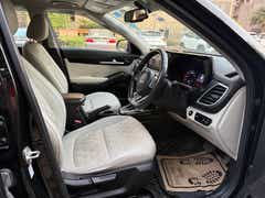Interior front seats and dashboard of a Kia Seltos