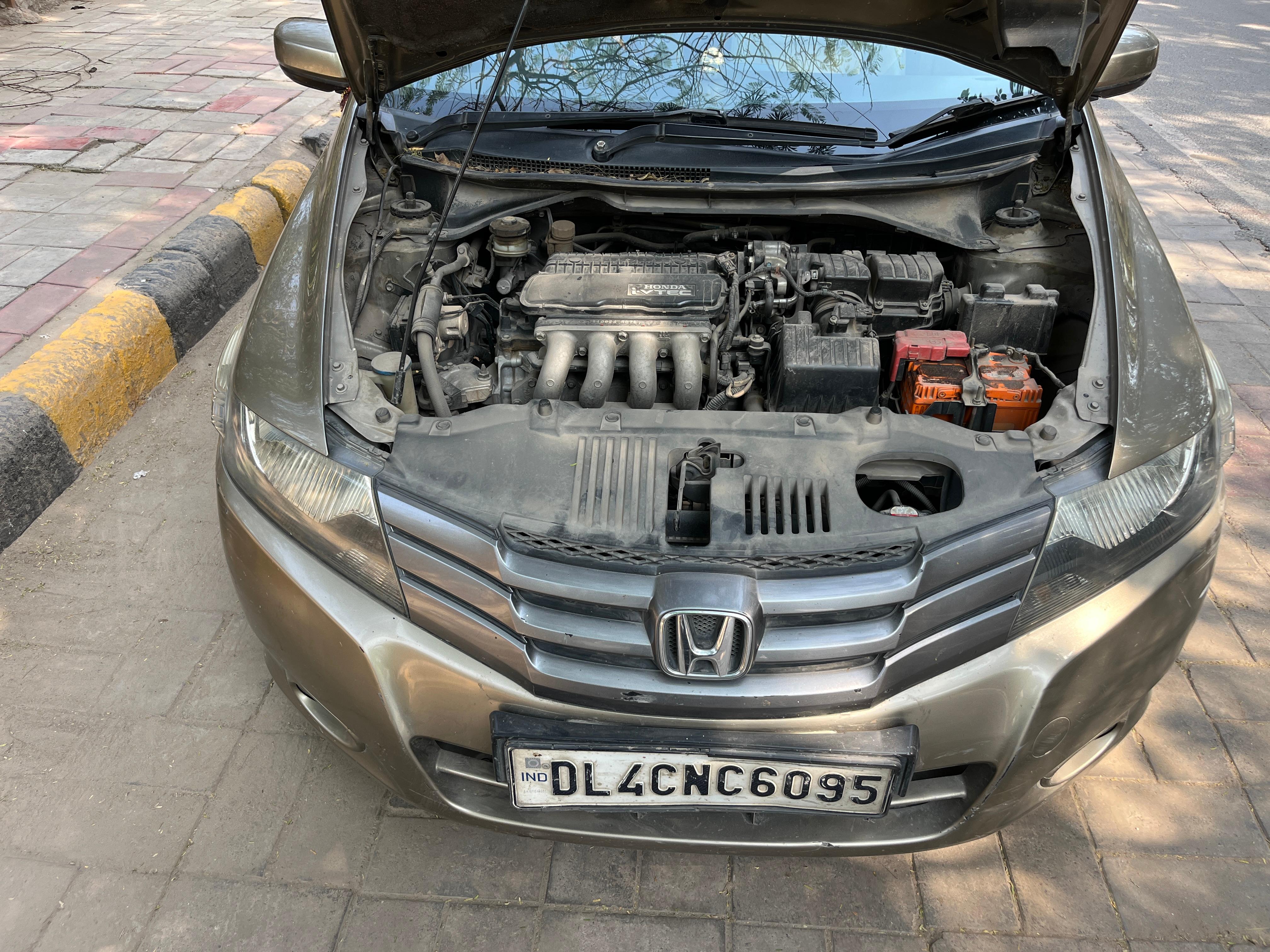 Engine bay view of a Honda City