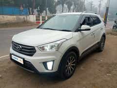 Front three quarter of a atlas white Hyundai Creta