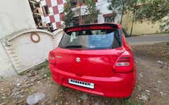 Rear view of a Sizzling Red Maruti Suzuki Swift