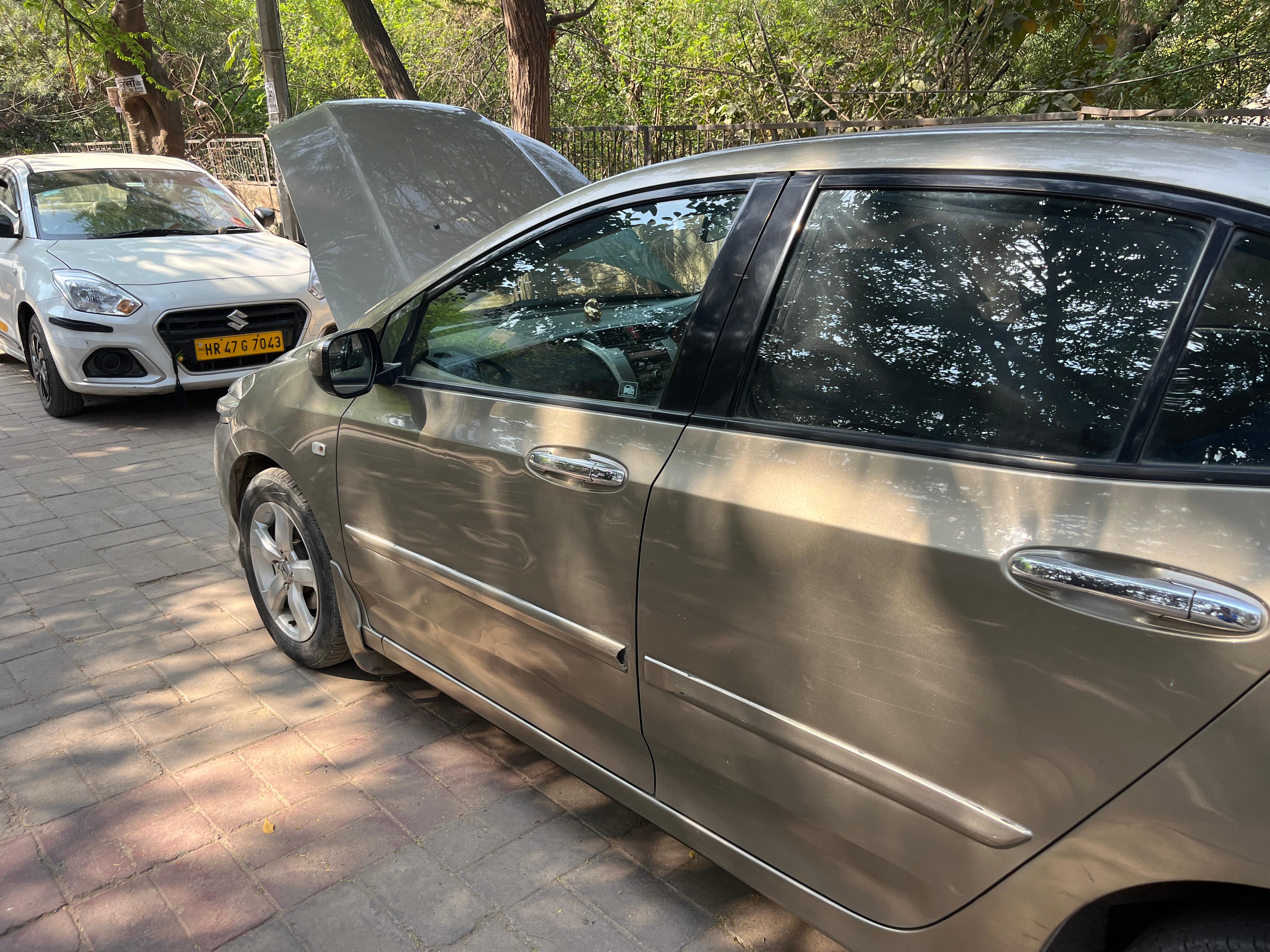 Side view of a Golden Brown Metallic Honda City
