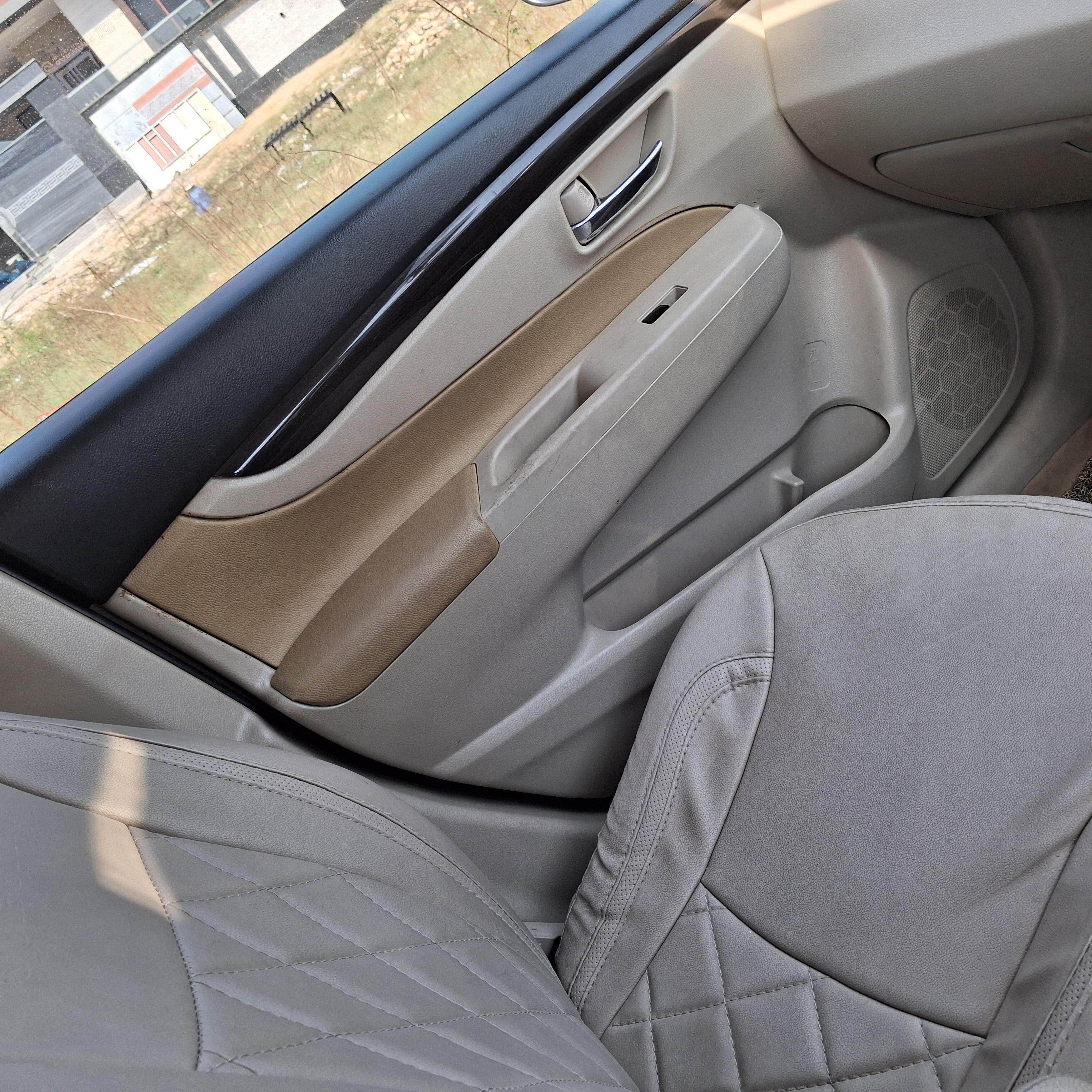 Front passenger door interior of a Maruti Suzuki Ciaz