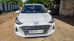 Front view of a atlas-white Hyundai Grand i10 Nios