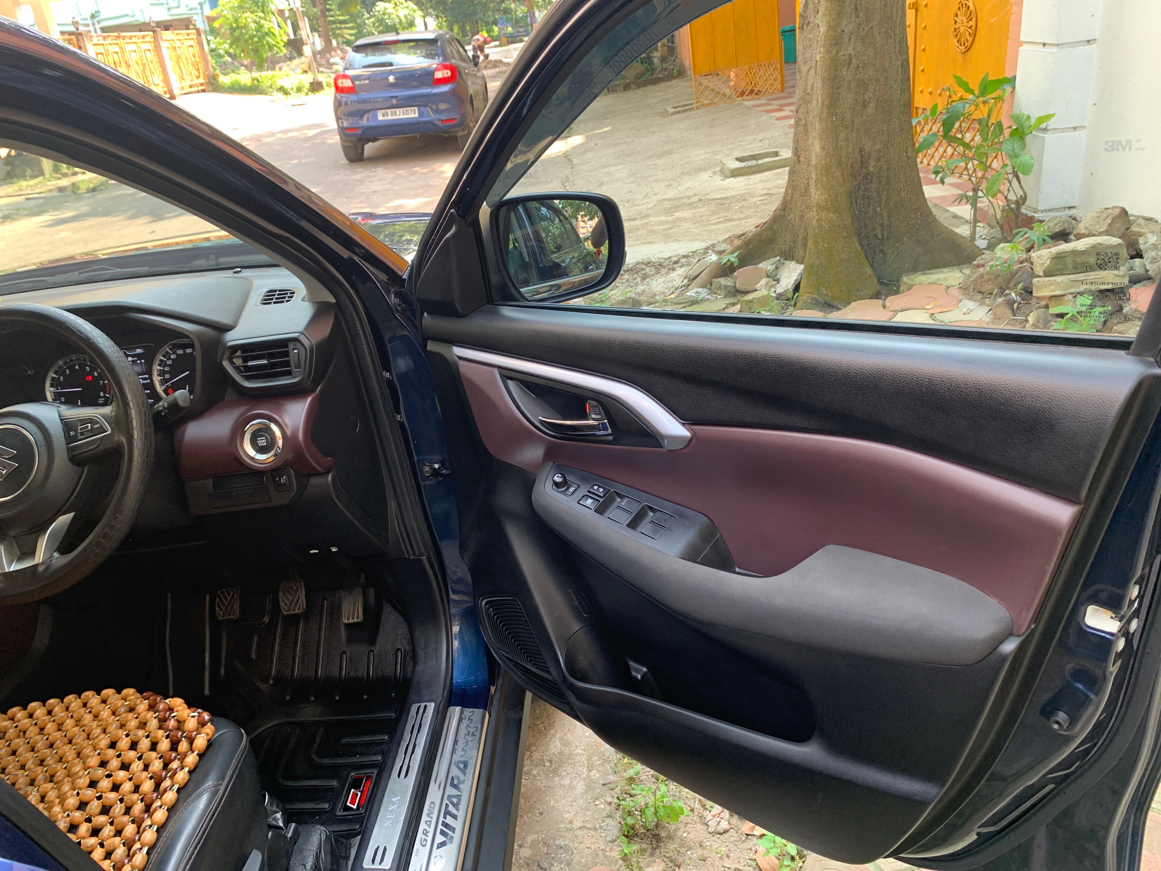 Driver side interior view of a Maruti Suzuki Grand Vitara