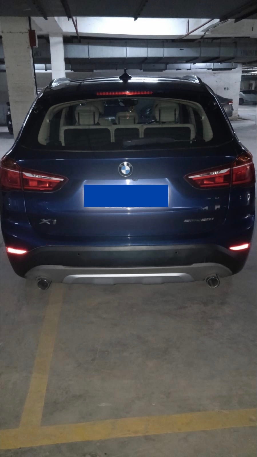 Rear view of a portimao-blue BMW X1