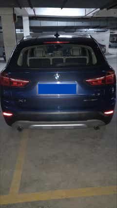 Rear view of a portimao-blue BMW X1