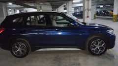 Side view of a Portimao Blue BMW X1