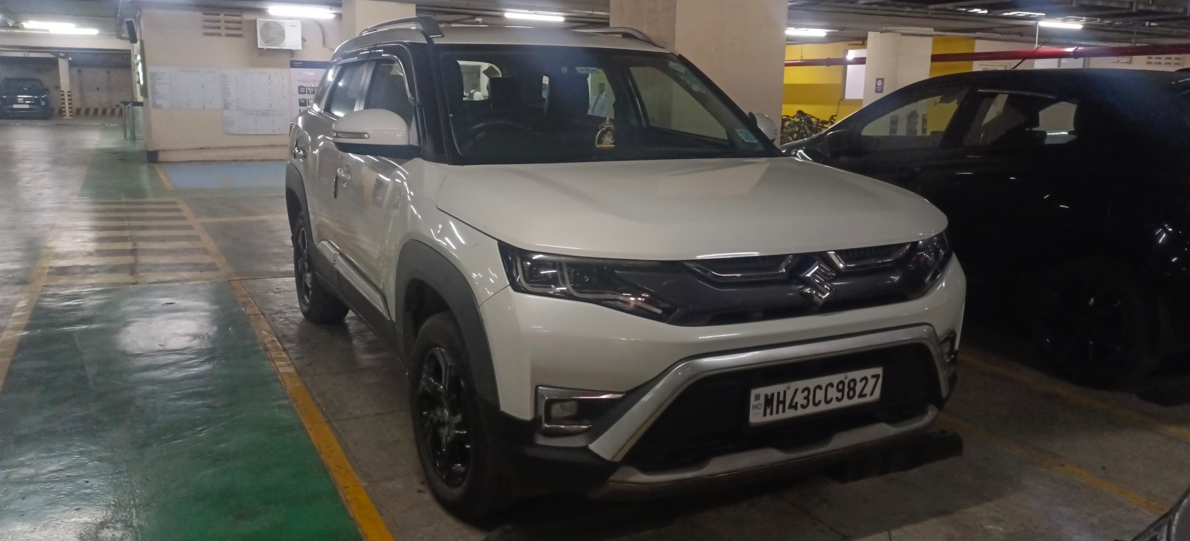 Front view of a pearl arctic white Maruti Suzuki Brezza