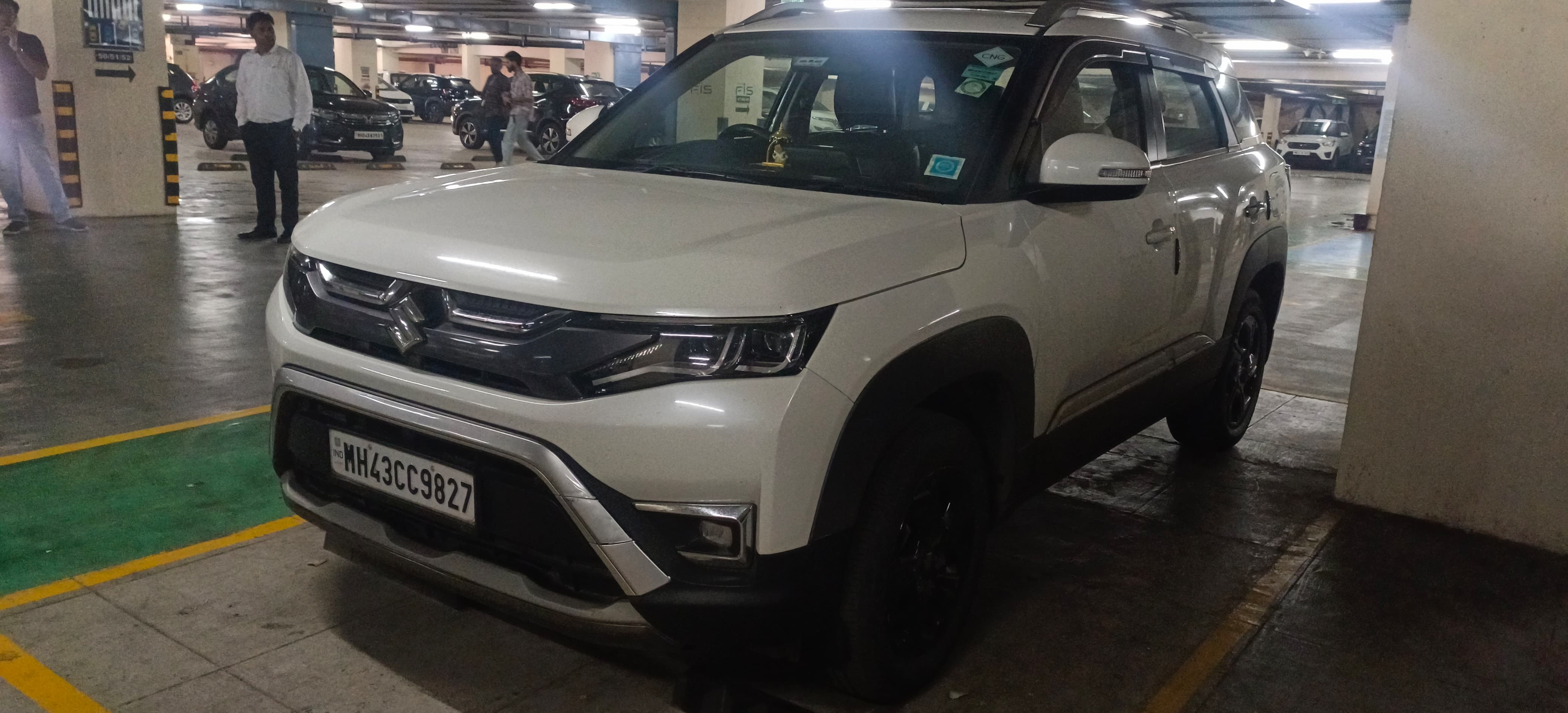 Front three-quarter view of a pearl arctic white Maruti Suzuki Brezza