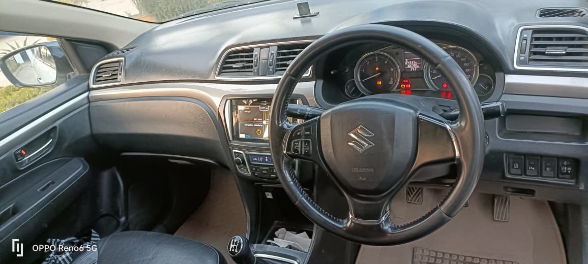 Interior dashboard and steering view of a Maruti Suzuki Ciaz