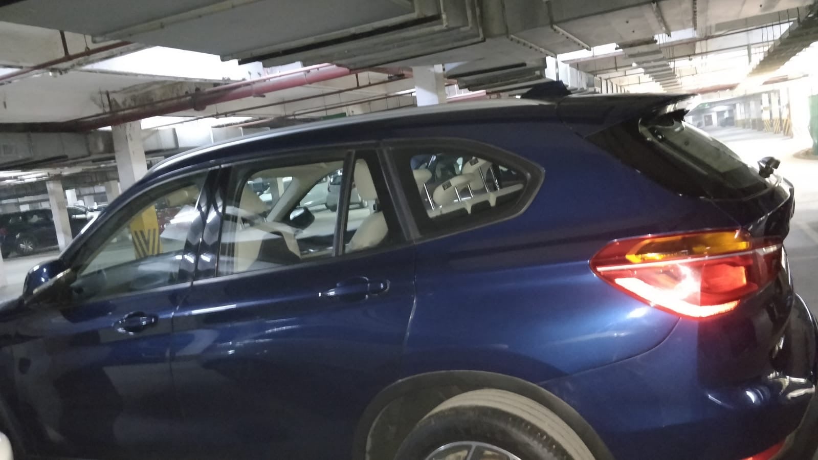 Side view of a Portimao Blue BMW X1