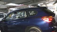 Side view of a Portimao Blue BMW X1
