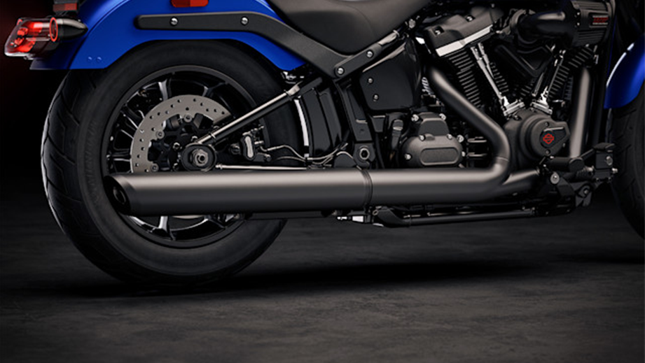 Rear wheel and exhaust view of a aurora blue denim Harley-Davidson Low Rider S