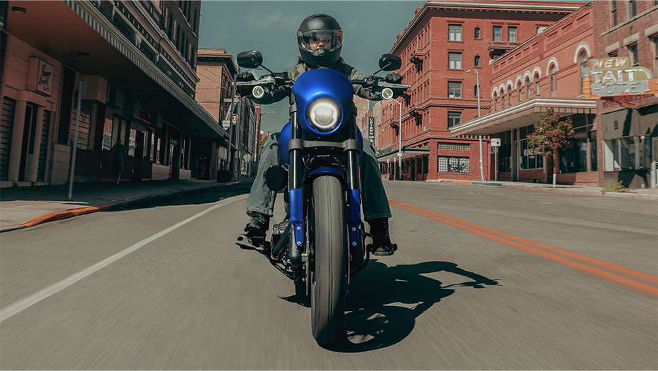 Front view of a aurora blue denim Harley-Davidson Low Rider S on city street