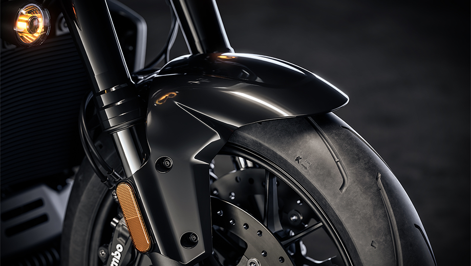 Front wheel and fender close up of a vivid black Harley-Davidson Pan America 1250 ST