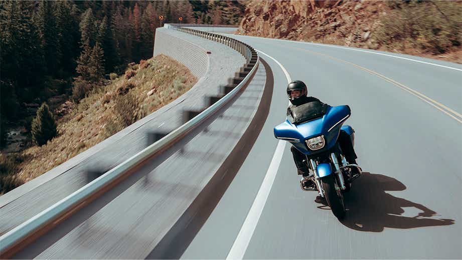 Front view of a Harley-Davidson Street Glide on a winding mountain road